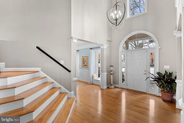 a kitchen with a stove a sink a refrigerator and wooden cabinets