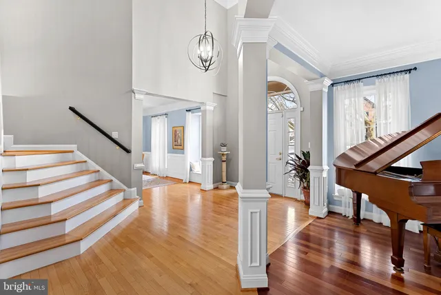 a kitchen with a stove and white cabinets