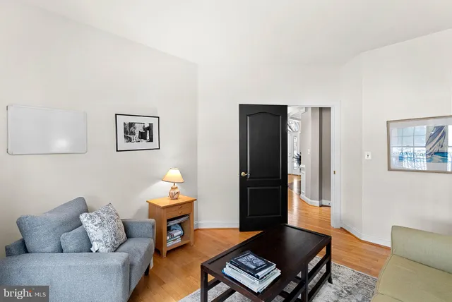 a room with furniture pool table and flat screen tv