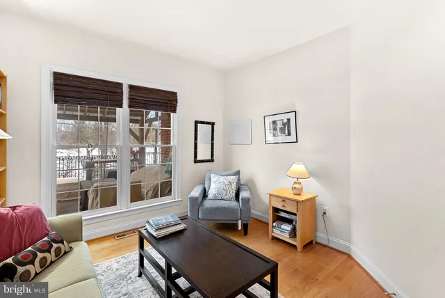 a room with furniture and pool table