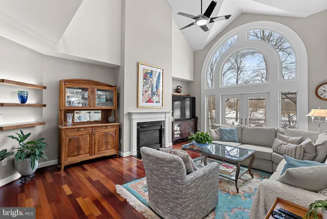 a bedroom with furniture and a wooden floor