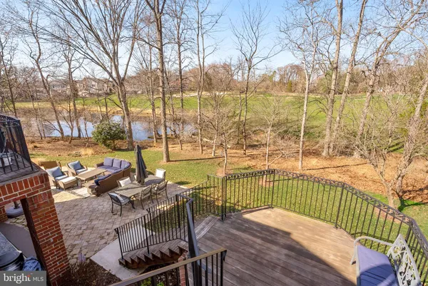a view of a backyard with table and chairs and a fire pit