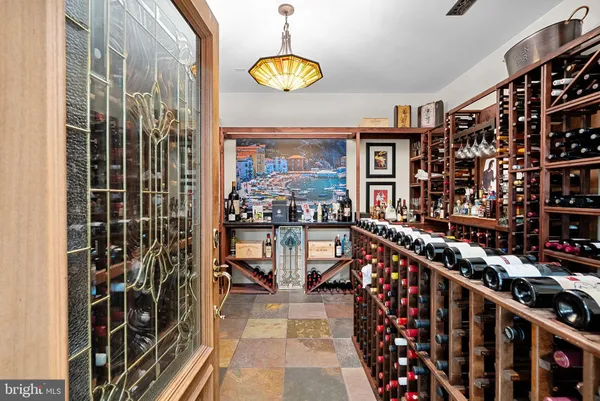 a kitchen with a stove a sink a refrigerator and wooden cabinets