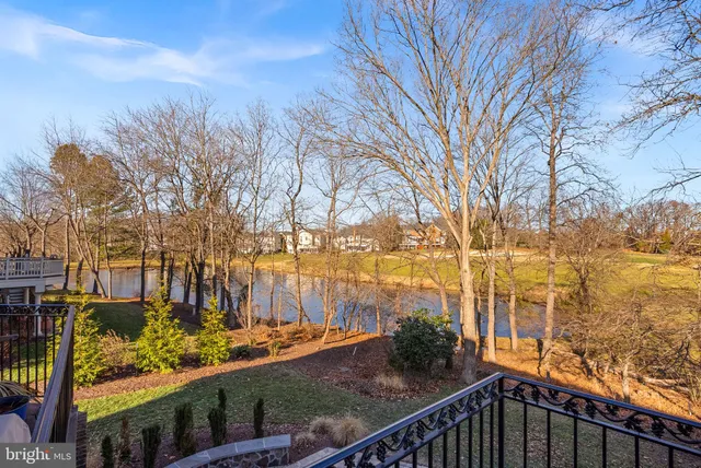 a view of a dining room with furniture and a chandelier