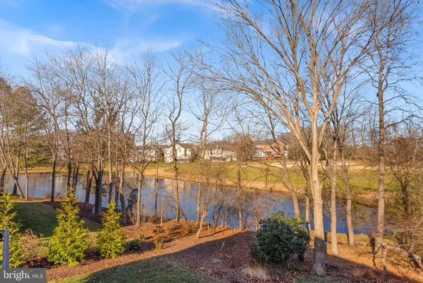 a kitchen with a stove and white cabinets