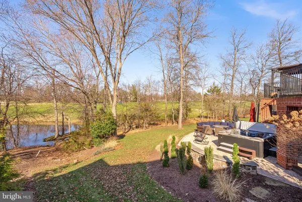 a spacious bathroom with a granite countertop tub sink and mirror