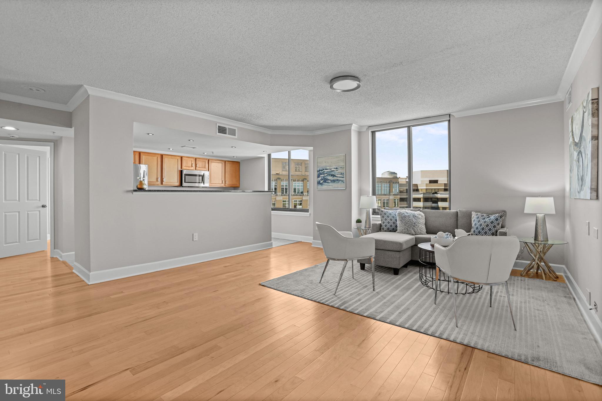 1220 North Fillmore Street, Unit 602 Arlington, VA 22201 - Photo 2 of 43 a living room with furniture and a wooden floor