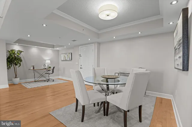 a dining room with furniture and window