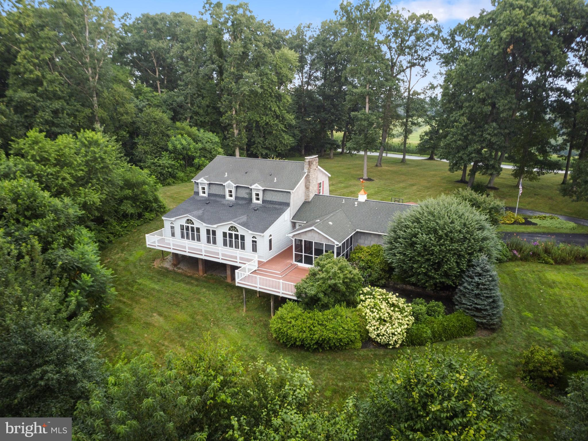 4850 Delta Road Delta, PA 17314 - Photo 1 of 74 an aerial view of a house with garden space and a bench