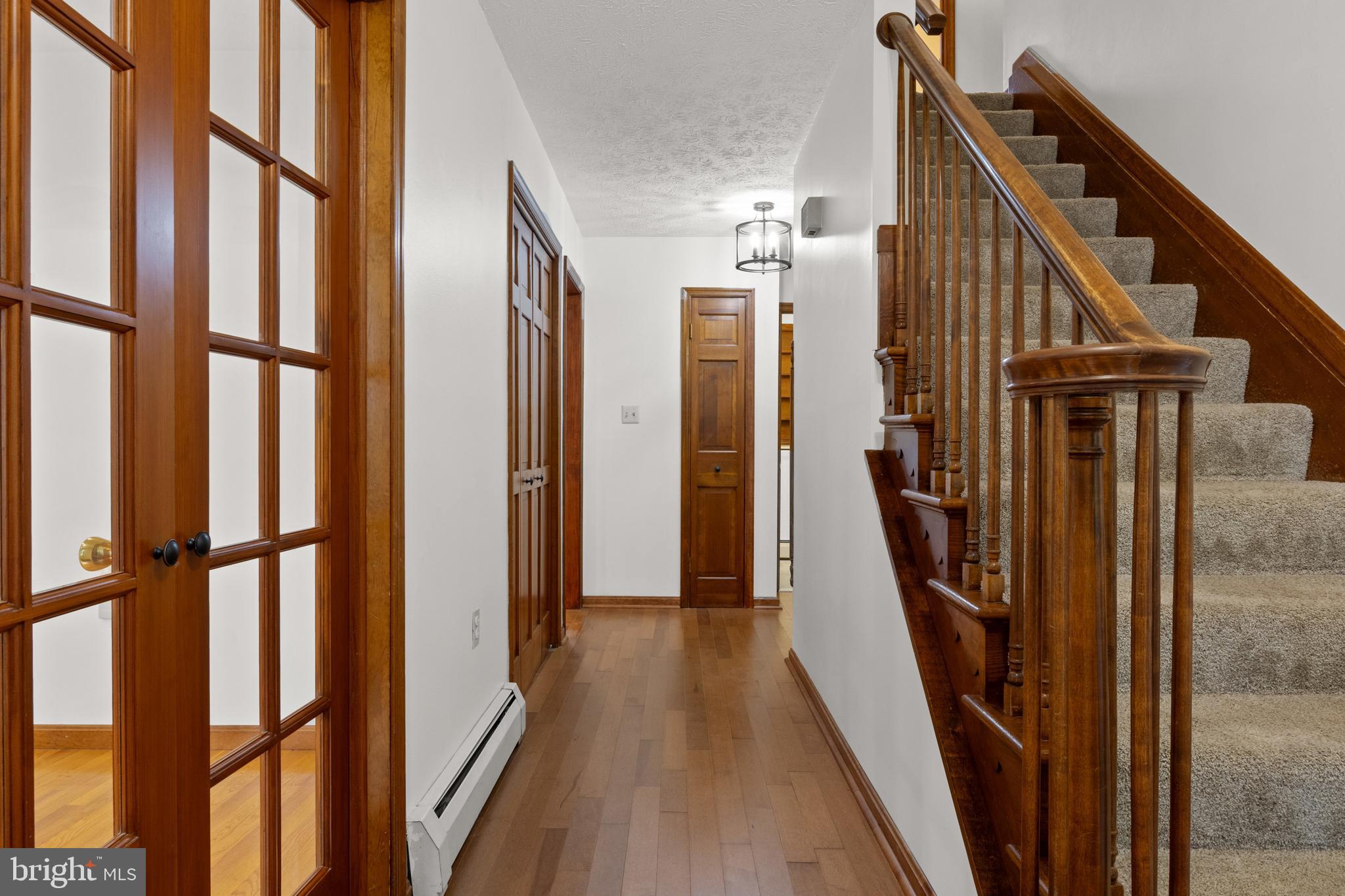 4850 Delta Road Delta, PA 17314 - Photo 21 of 74 a view of a hallway with wooden floor and staircase