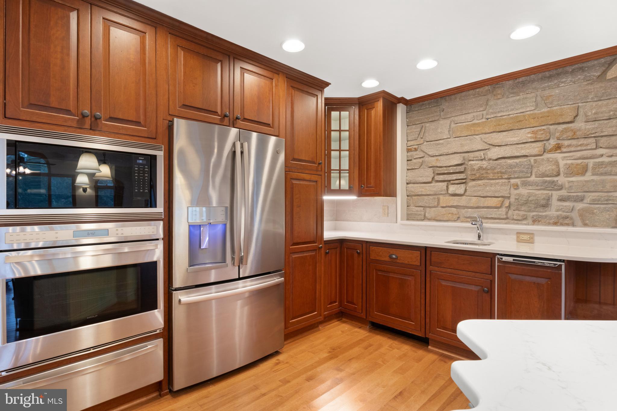 4850 Delta Road Delta, PA 17314 - Photo 32 of 74 a kitchen with stainless steel appliances granite countertop a refrigerator and a sink