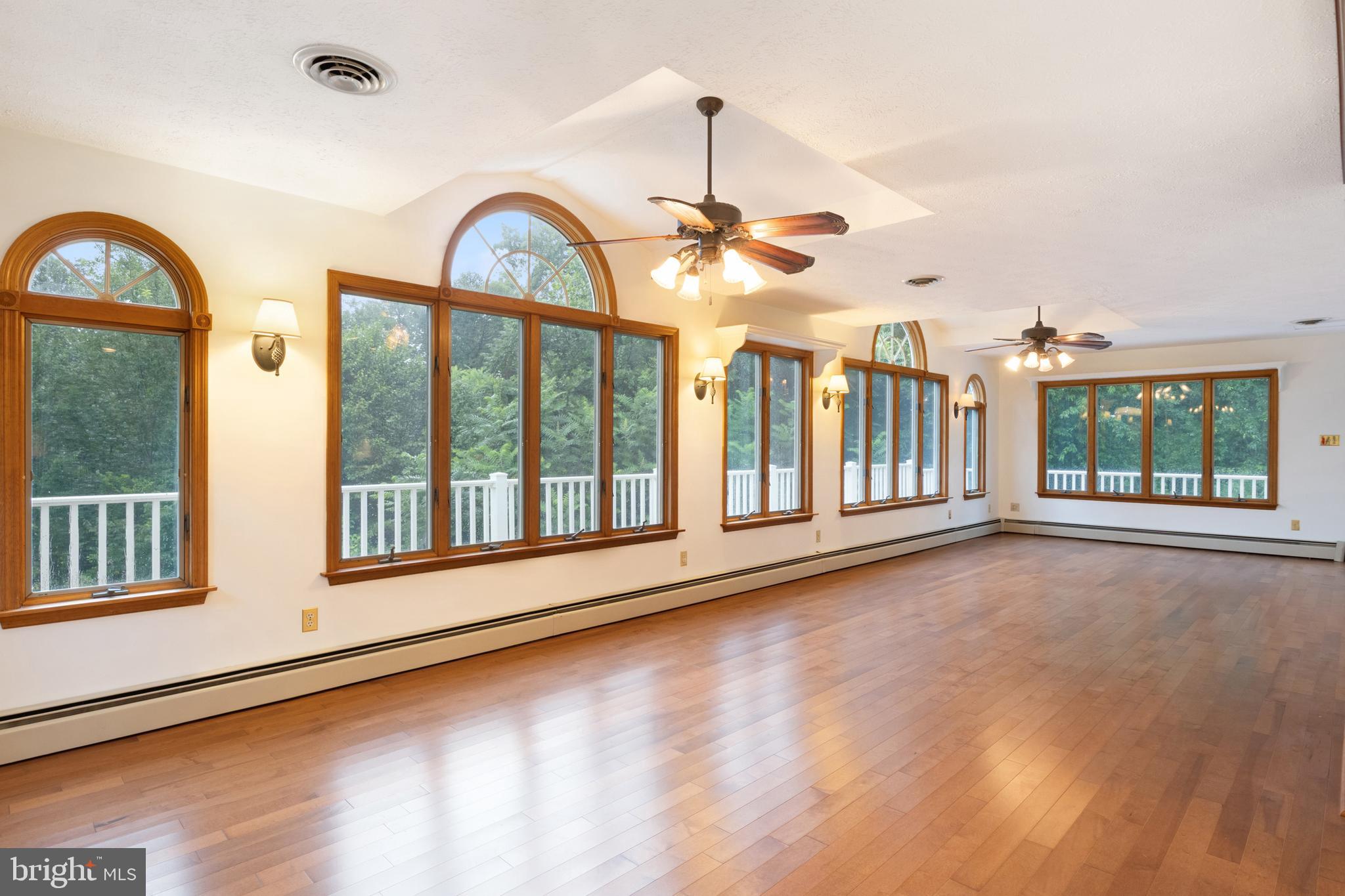 4850 Delta Road Delta, PA 17314 - Photo 34 of 74 a view of an empty room with a window and wooden floor