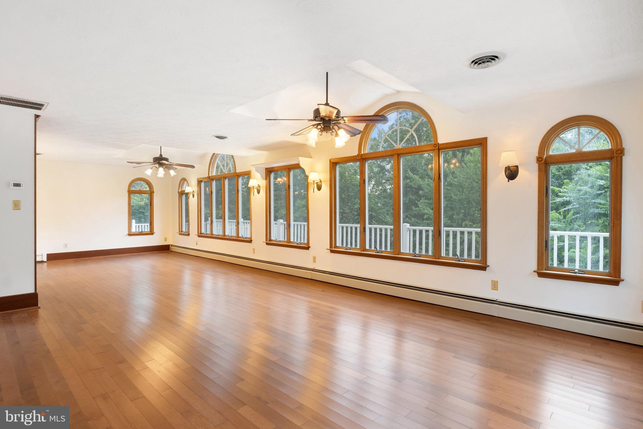4850 Delta Road Delta, PA 17314 - Photo 35 of 74 a view of a big room with wooden floor windows and a living room