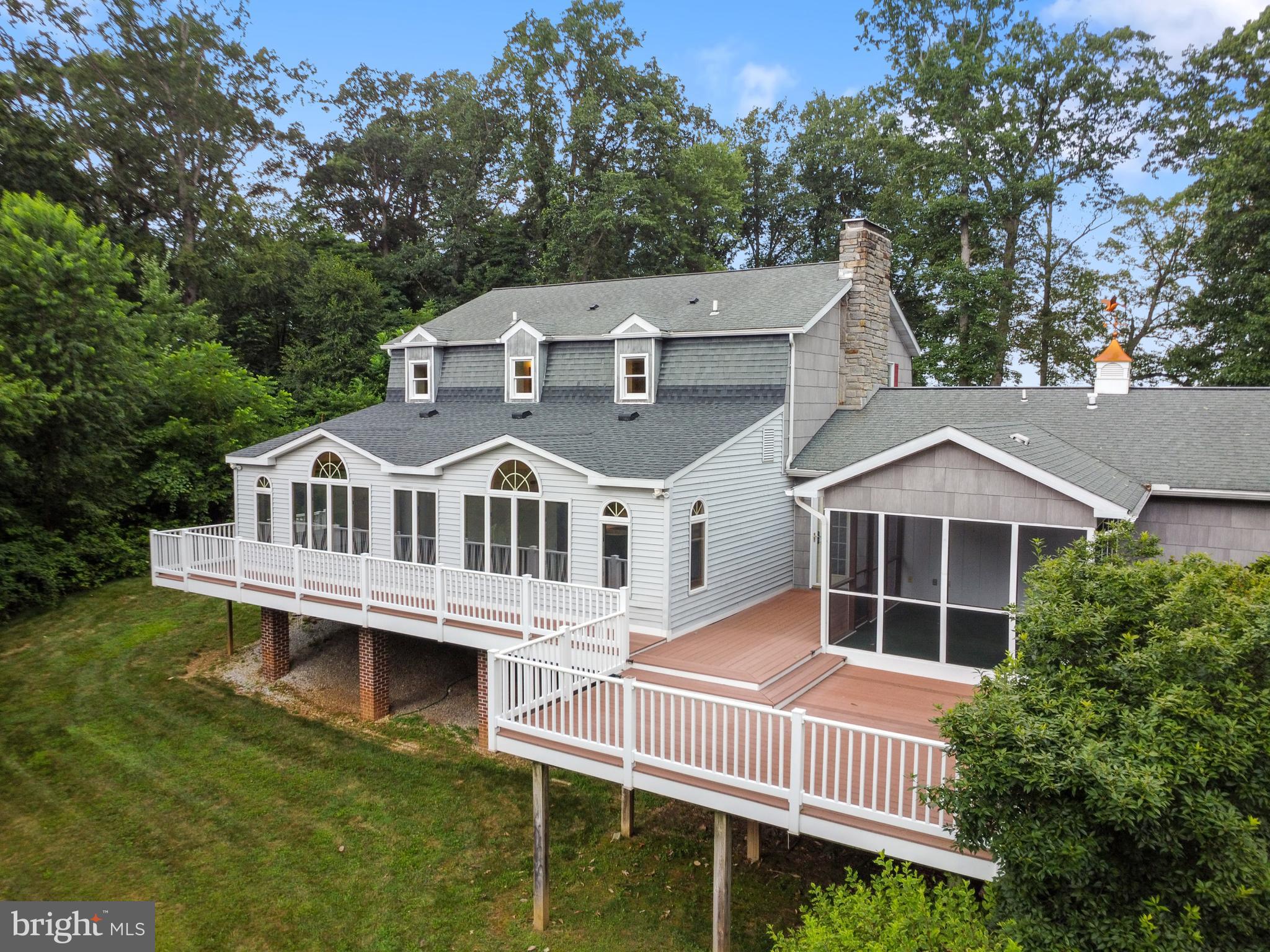 4850 Delta Road Delta, PA 17314 - Photo 4 of 74 a front view of a house with a yard and potted plants