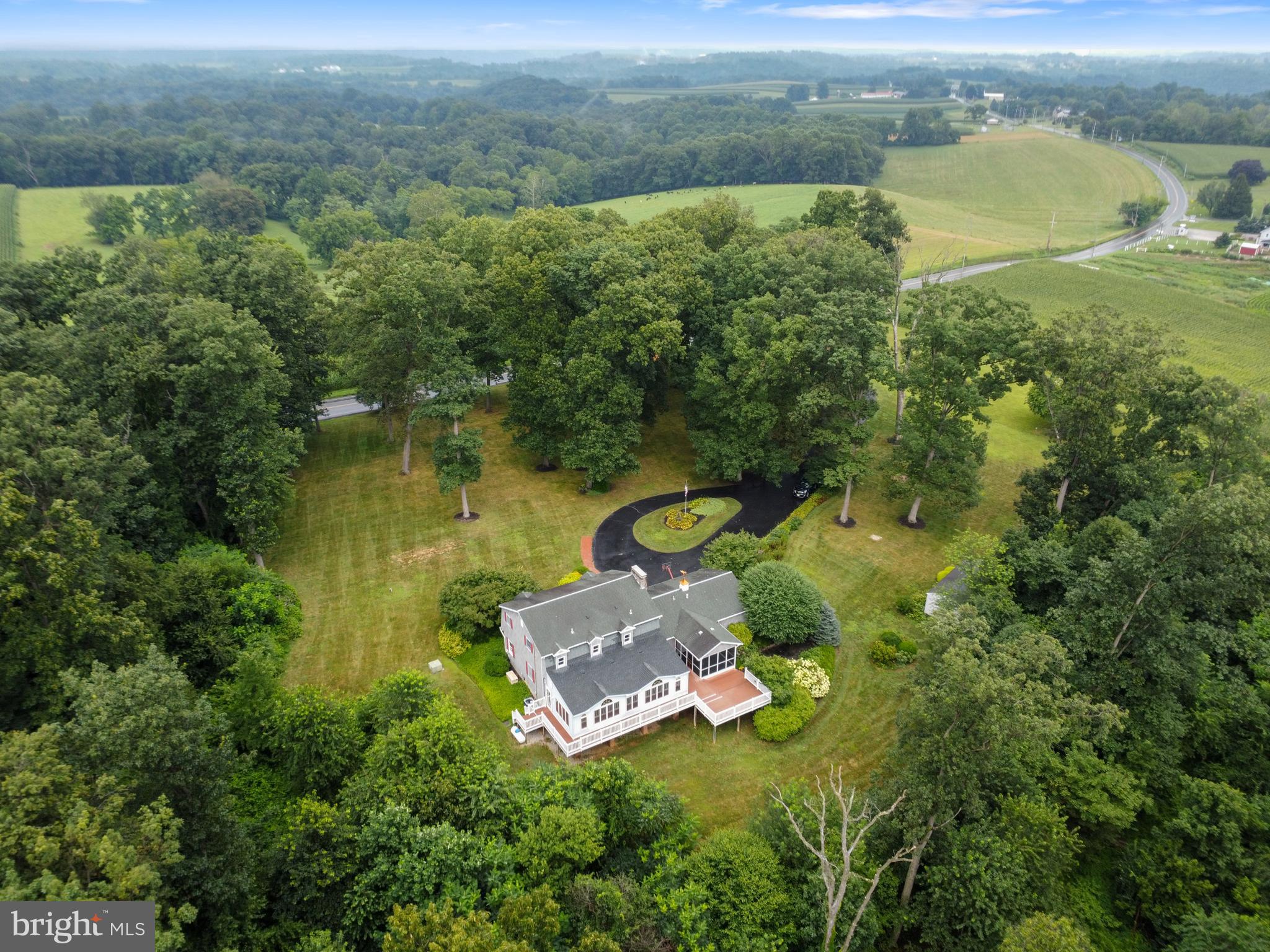 4850 Delta Road Delta, PA 17314 - Photo 5 of 74 an aerial view of a house with a garden and lake view