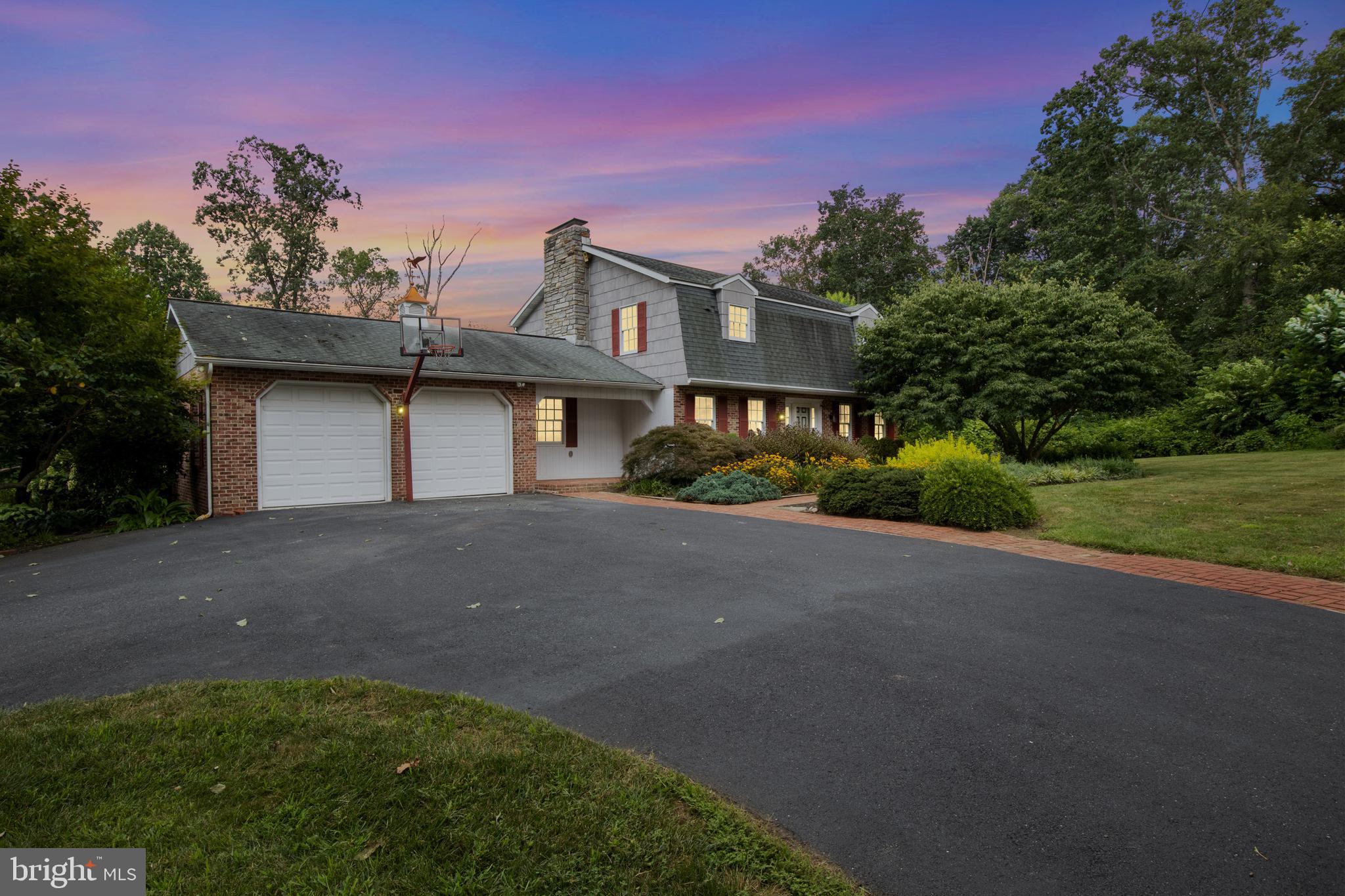 4850 Delta Road Delta, PA 17314 - Photo 8 of 74 a front view of a house with a yard and garage
