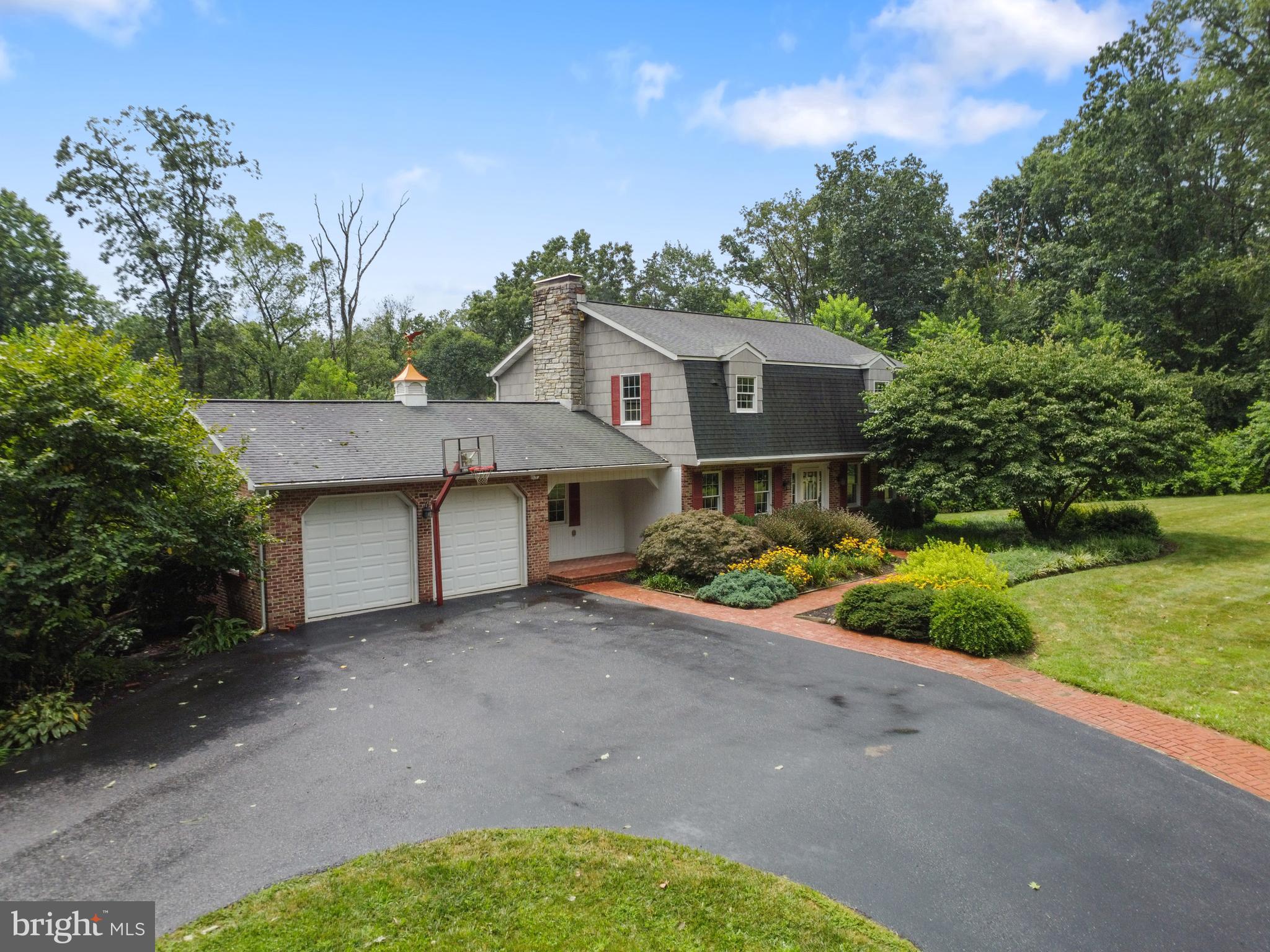 4850 Delta Road Delta, PA 17314 - Photo 10 of 74 a front view of a house with a garden and yard