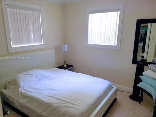 a view of outdoor space with garden and trees