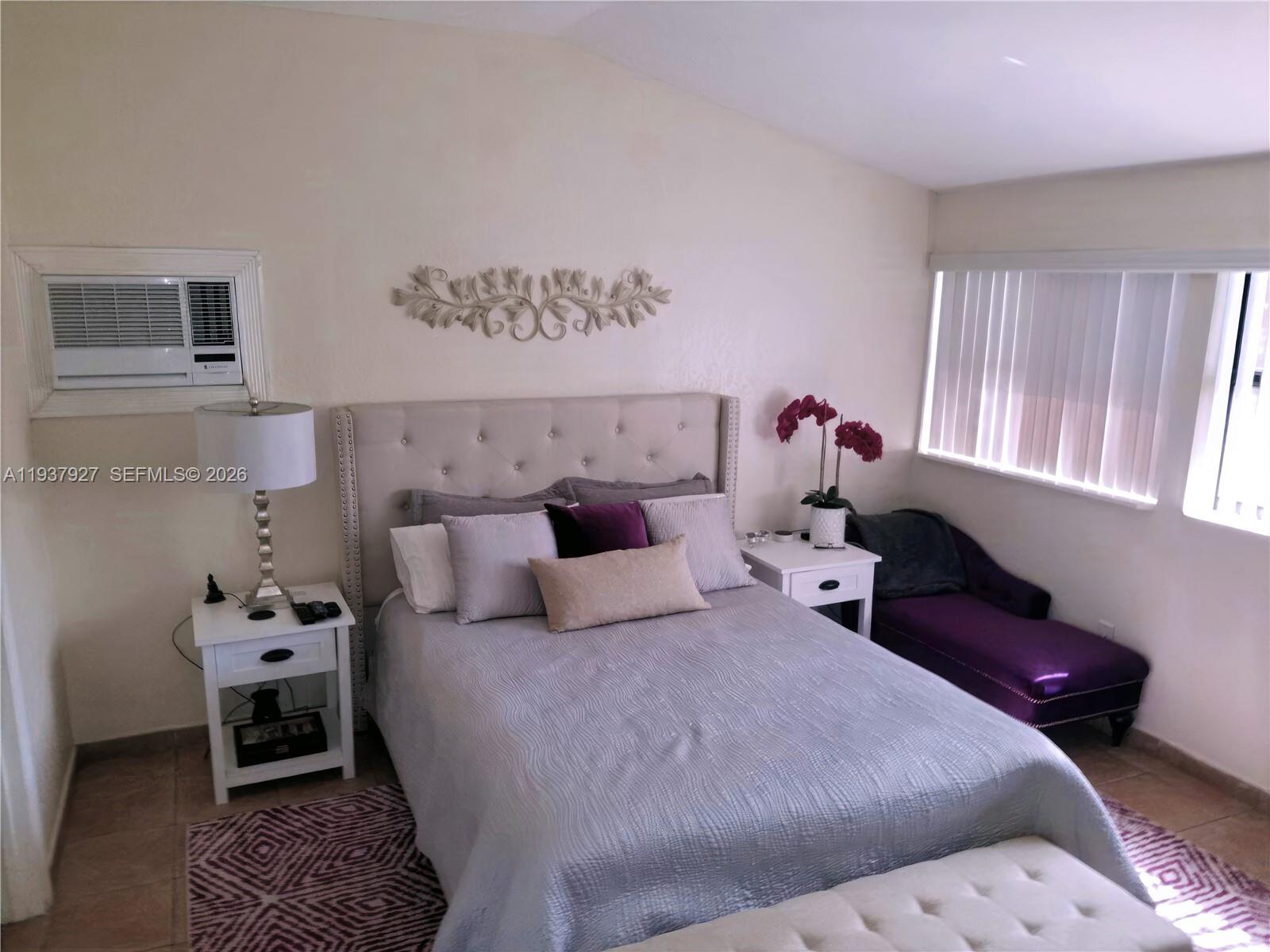 12501 Southwest 90th Avenue Miami, FL 33176 - Photo 19 of 27 a bedroom with a bed and a window