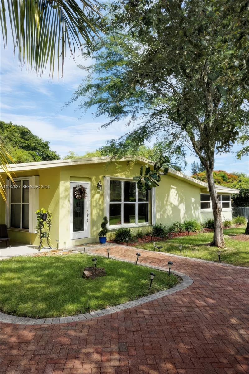 12501 Southwest 90th Avenue Miami, FL 33176 - Photo 3 of 27 front view of a house with a yard
