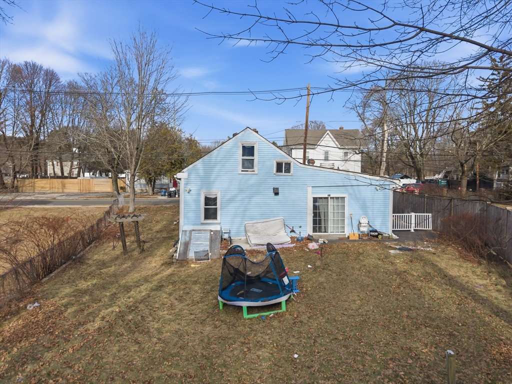 62 Main Street Saugus, MA 01906 - Photo 21 of 24 a backyard of a house with table and chairs