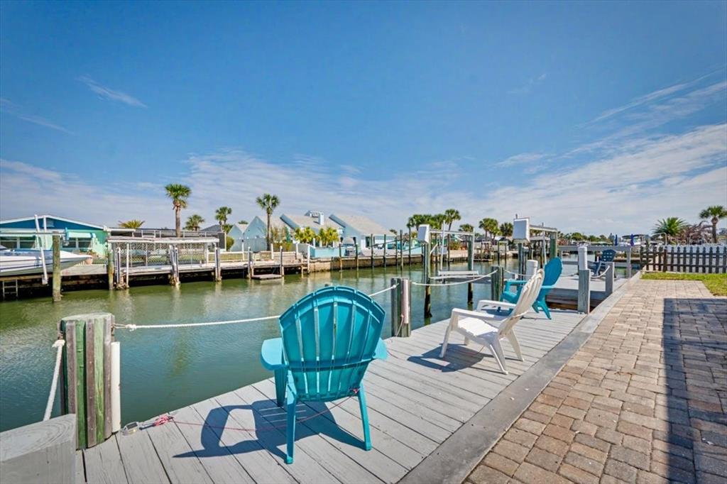 124 Anchor Drive Ponce Inlet, FL 32127 - Photo 11 of 77 a view of a lake from a balcony with furniture