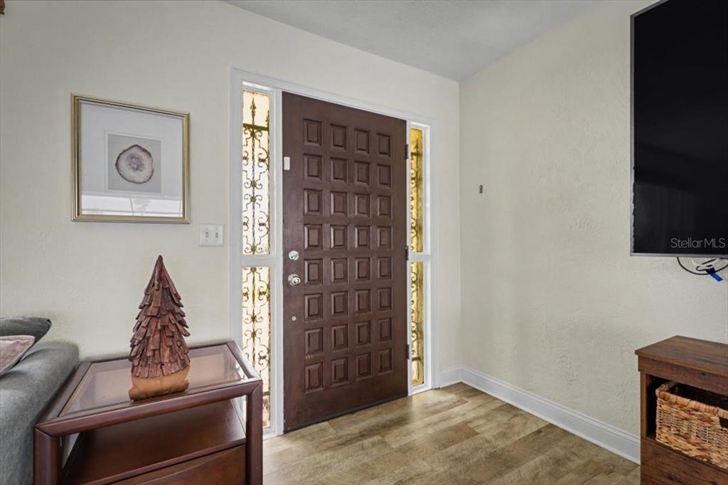 124 Anchor Drive Ponce Inlet, FL 32127 - Photo 13 of 77 a view of a livingroom with furniture and staircase with white walls