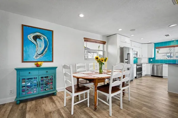 a kitchen with stainless steel appliances granite countertop a stove and a refrigerator