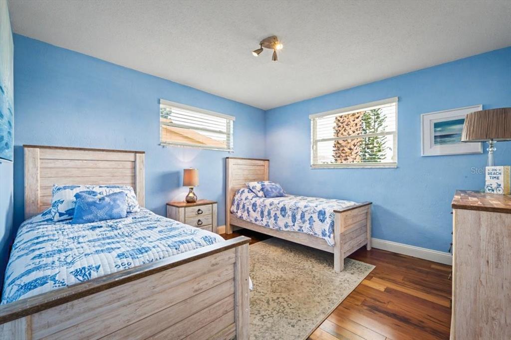 124 Anchor Drive Ponce Inlet, FL 32127 - Photo 25 of 77 a bedroom with a bed and window