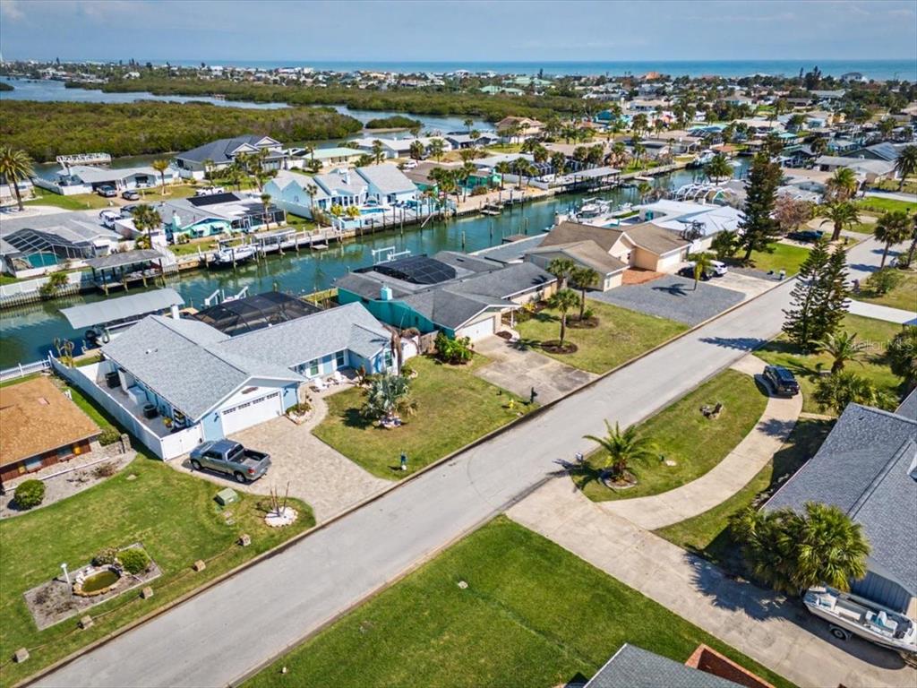 124 Anchor Drive Ponce Inlet, FL 32127 - Photo 57 of 77 an aerial view of a residential houses with outdoor space