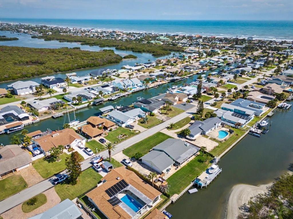 124 Anchor Drive Ponce Inlet, FL 32127 - Photo 58 of 77 an aerial view of residential houses with outdoor space