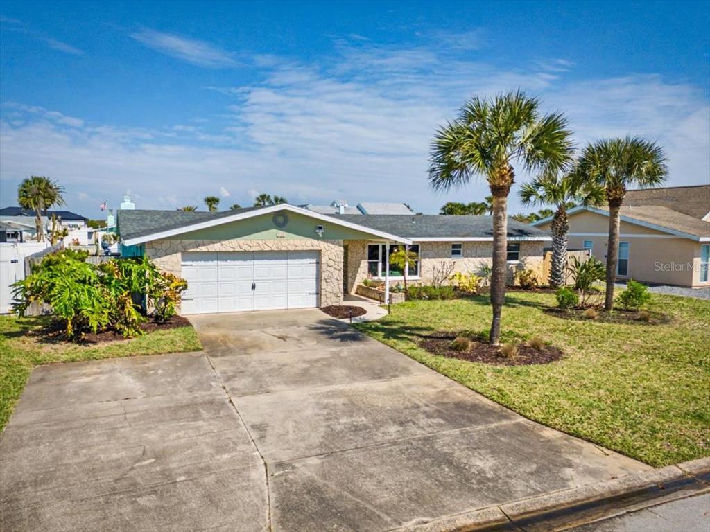 124 Anchor Drive Ponce Inlet, FL 32127 - Photo 63 of 77 a view of a house with a sink and a yard