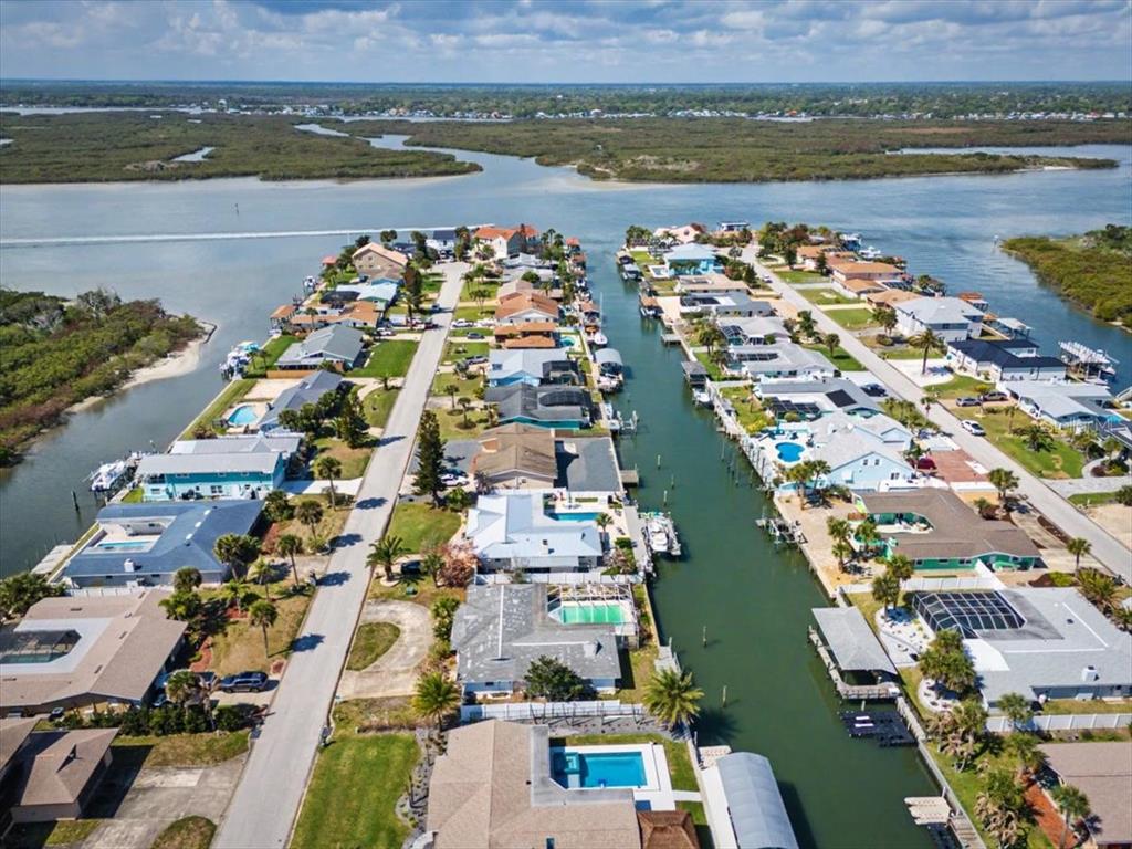 124 Anchor Drive Ponce Inlet, FL 32127 - Photo 64 of 77 an aerial view of a city with ocean view