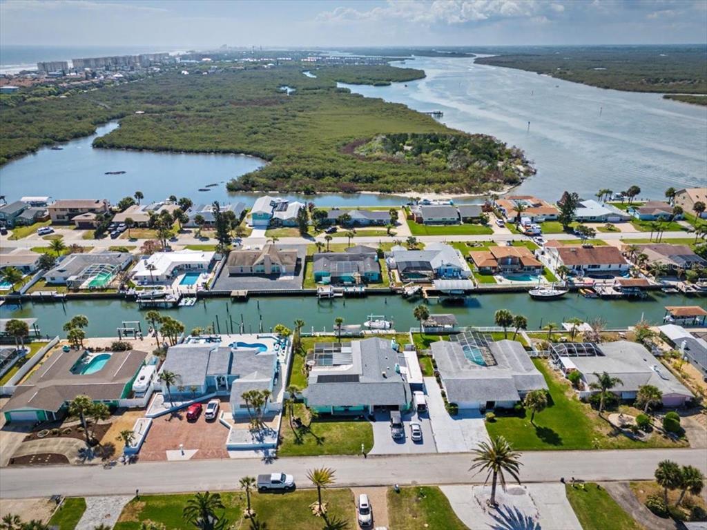 124 Anchor Drive Ponce Inlet, FL 32127 - Photo 66 of 77 an aerial view of residential houses with outdoor space