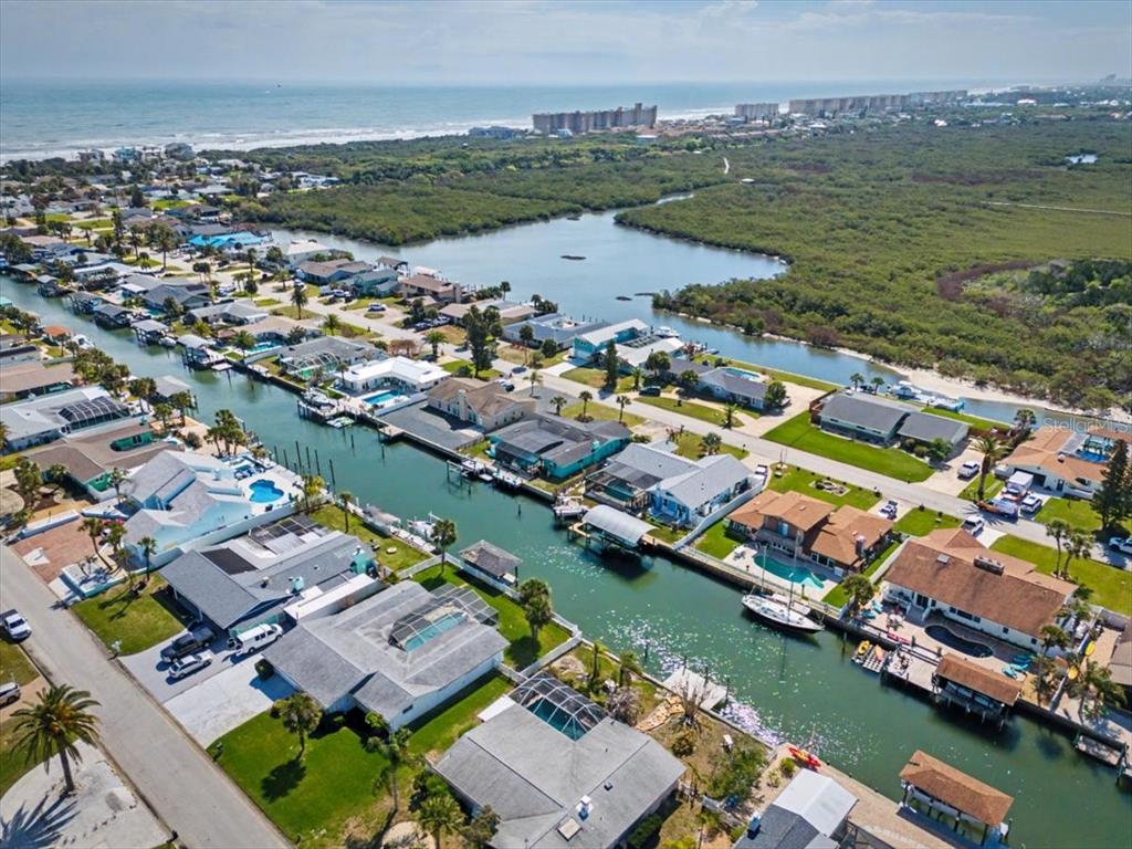 124 Anchor Drive Ponce Inlet, FL 32127 - Photo 67 of 77 an aerial view of residential houses with outdoor space