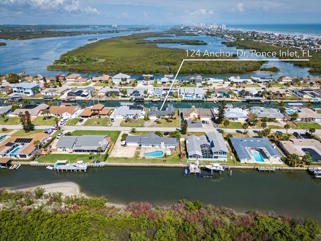 124 Anchor Drive Ponce Inlet, FL 32127 - Photo 72 of 77 an aerial view of residential houses with outdoor space