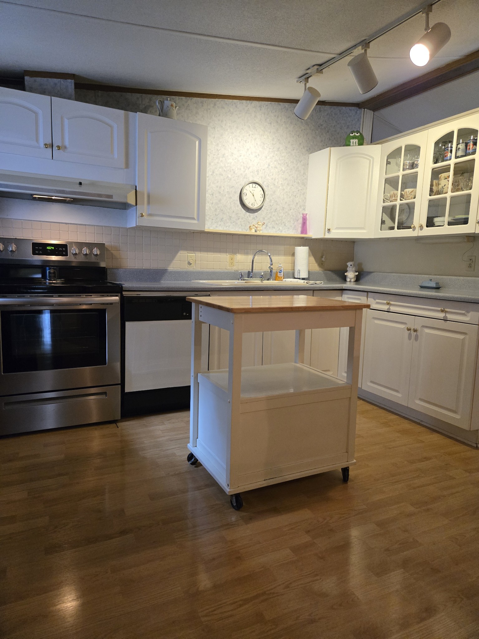 2130 Irwin Branch Road Waynesboro, TN 38485 - Photo 12 of 33 a kitchen with stainless steel appliances granite countertop a stove a sink and a microwave