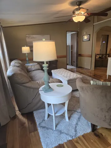 a spacious bedroom with a bed and a window