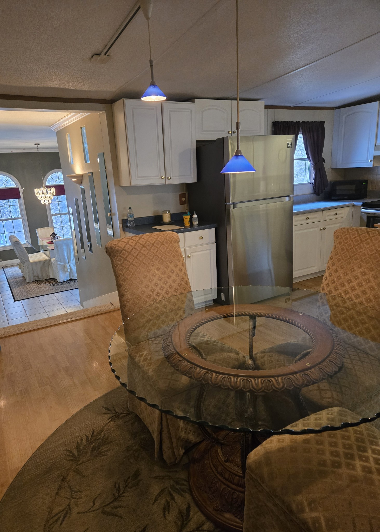 2130 Irwin Branch Road Waynesboro, TN 38485 - Photo 10 of 33 a kitchen with a refrigerator and a wooden floor