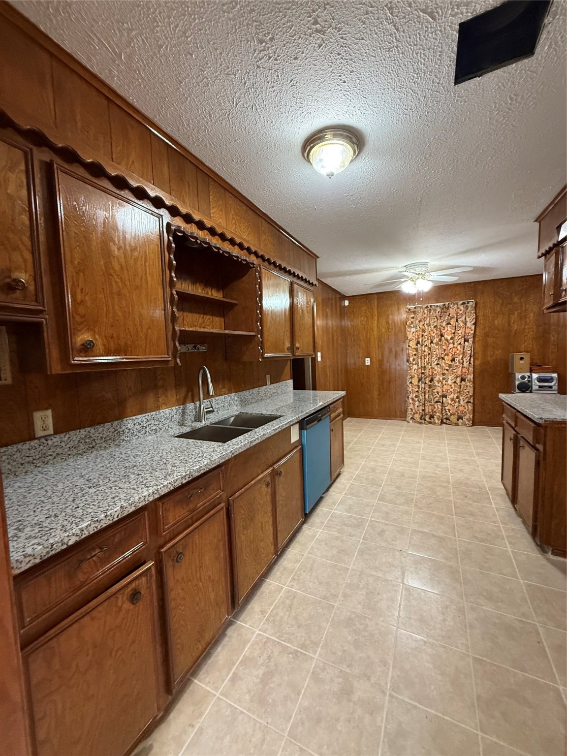7325 Ley Road Houston, TX 77028 - Photo 11 of 50 a large kitchen with kitchen island a sink stainless steel appliances and cabinets