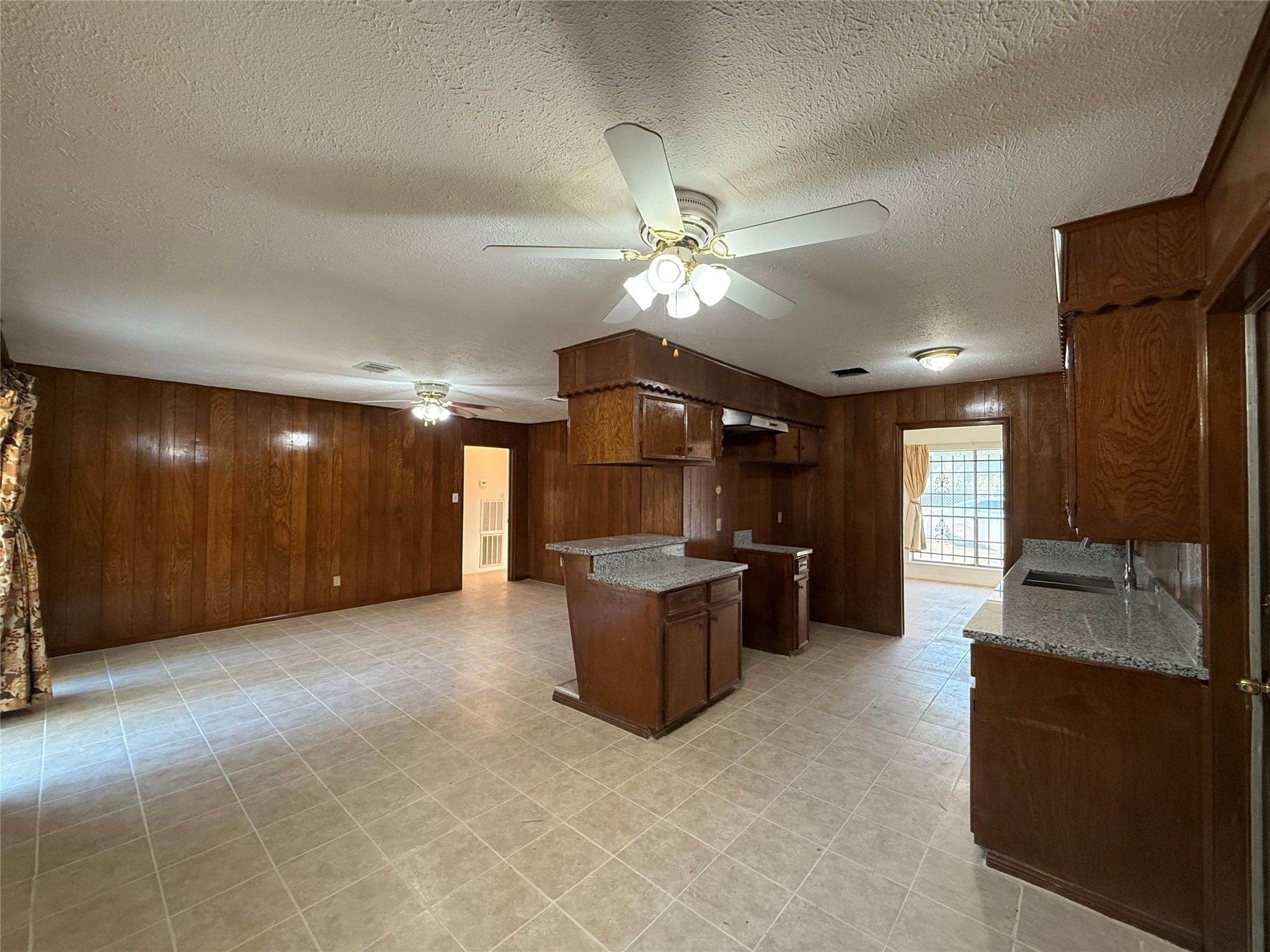 7325 Ley Road Houston, TX 77028 - Photo 12 of 50 a living room with furniture and a chandelier