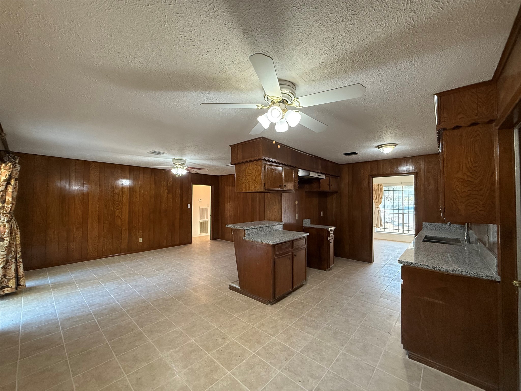 7325 Ley Road Houston, TX 77028 - Photo 13 of 50 a living room with furniture and a chandelier