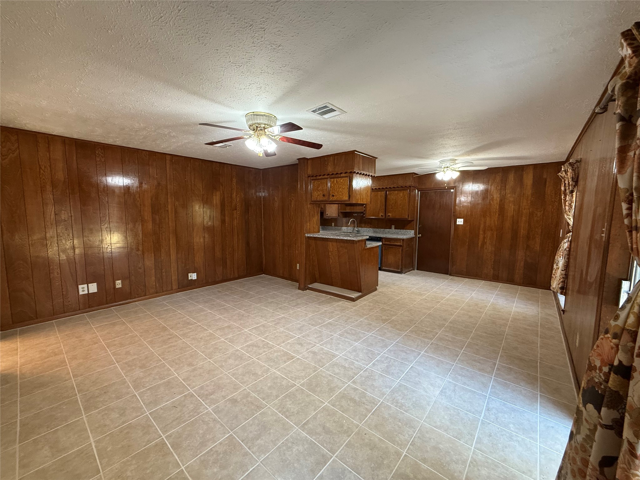 7325 Ley Road Houston, TX 77028 - Photo 15 of 50 a view of a livingroom with furniture and chandelier fan