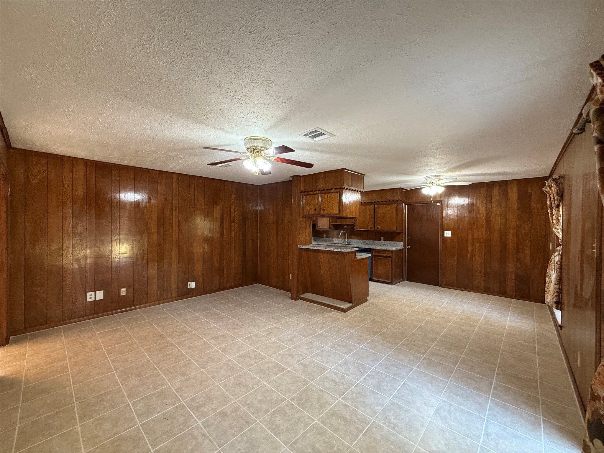 7325 Ley Road Houston, TX 77028 - Photo 16 of 50 a view of a livingroom with a kitchen