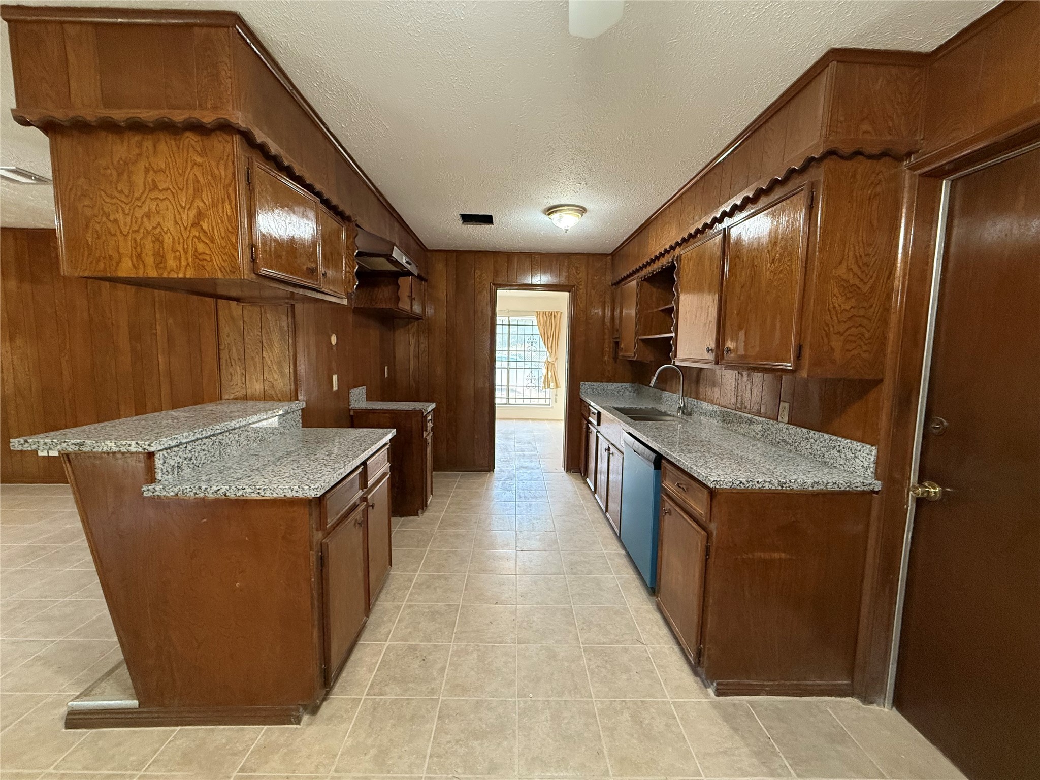 7325 Ley Road Houston, TX 77028 - Photo 17 of 50 a kitchen with a stove and a cabinets