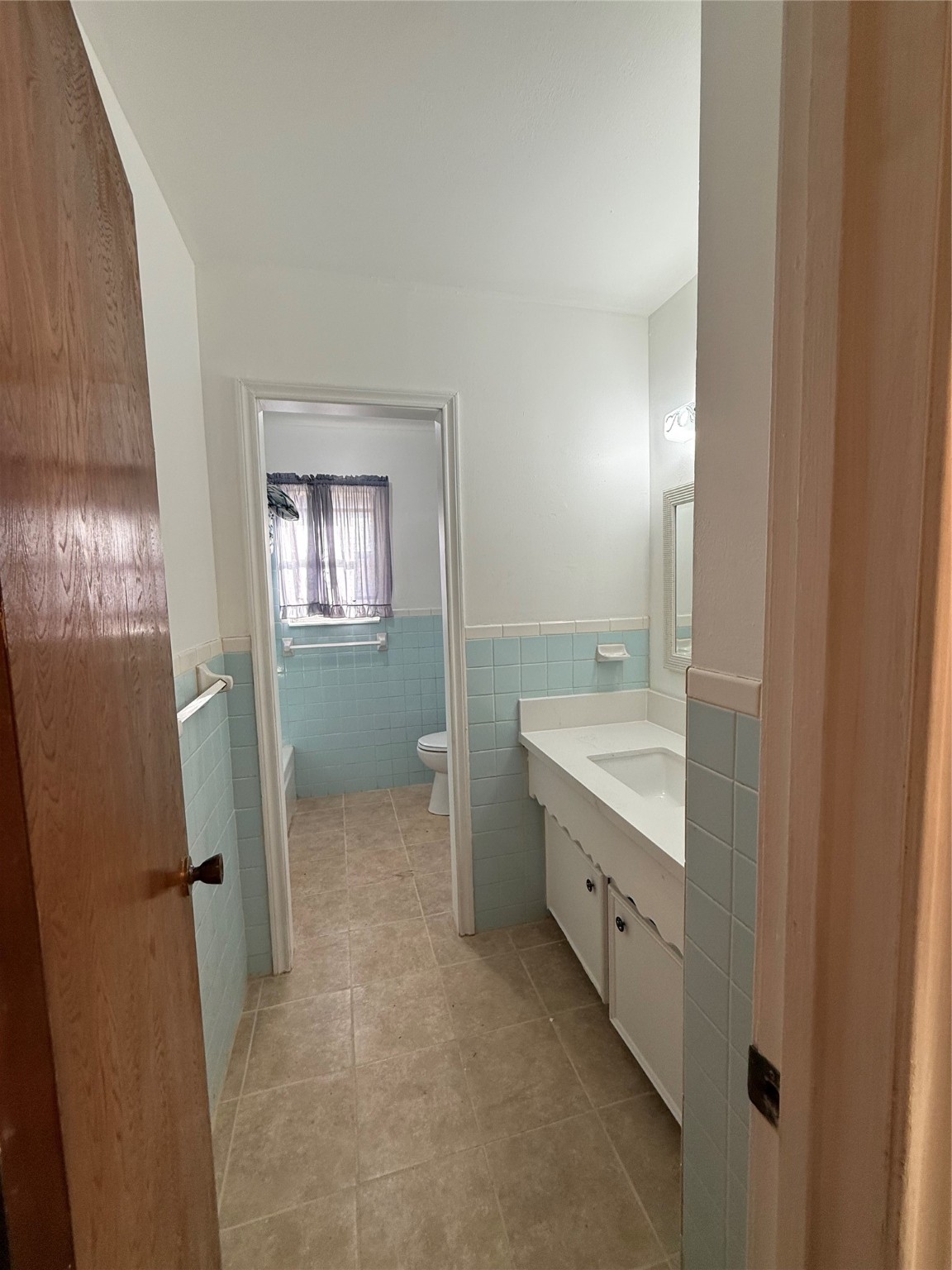 7325 Ley Road Houston, TX 77028 - Photo 18 of 50 a bathroom with a double vanity sink and mirror