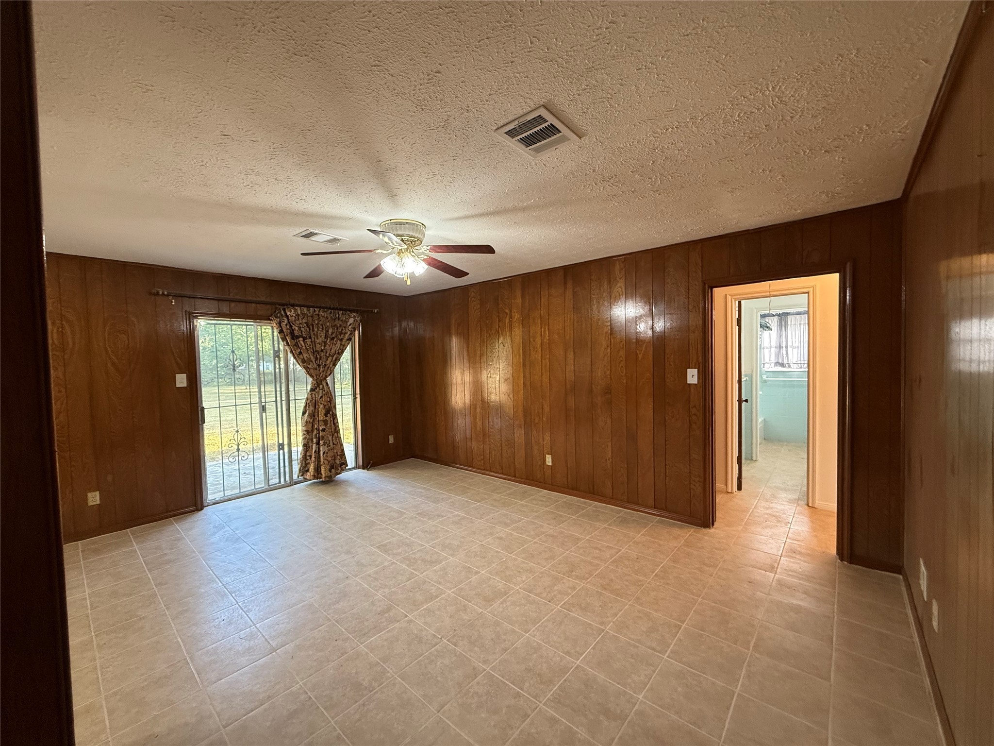 7325 Ley Road Houston, TX 77028 - Photo 19 of 50 a view of an empty room with a chandelier