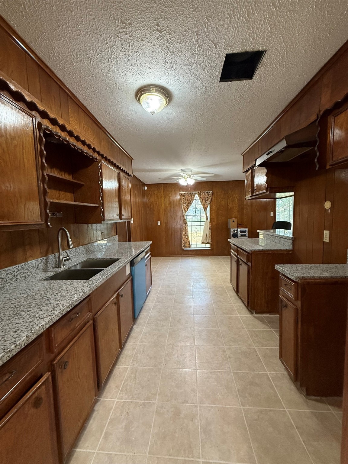 7325 Ley Road Houston, TX 77028 - Photo 10 of 50 a large kitchen with stainless steel appliances and a sink