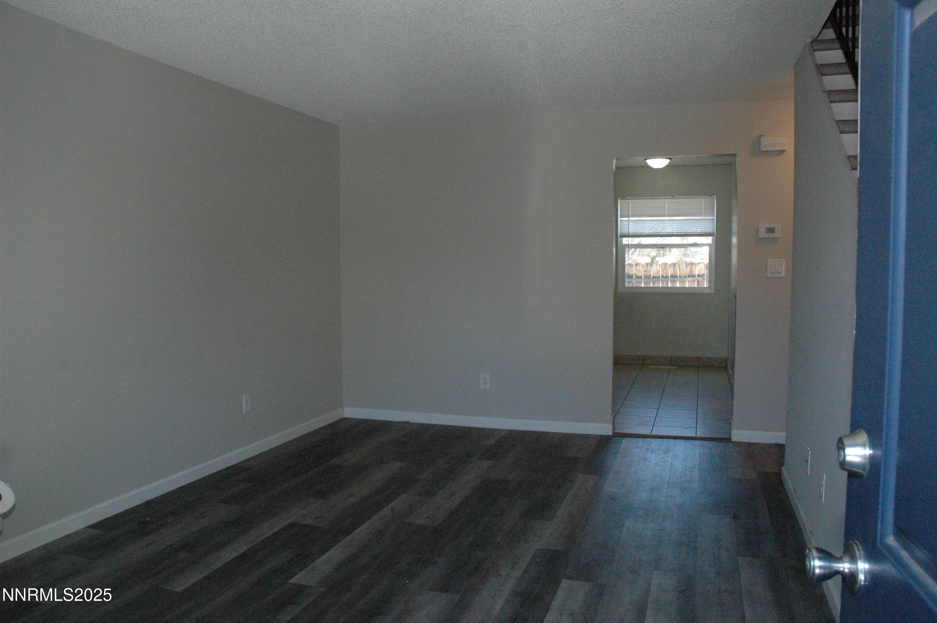 1424 East 9th Street, Unit 2 Reno, NV 89512 - Photo 12 of 20 a view of room with window and hardwood floor