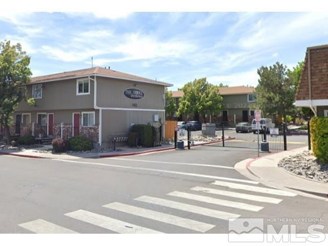 1424 East 9th Street, Unit 2 Reno, NV 89512 - Photo 2 of 20 a view of a building with many windows